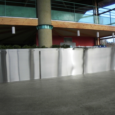 Habillage d'un bar de salle des fêtes en inox brossé - Montoison